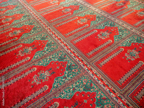 Photography islamic praying carpet inside a mosque