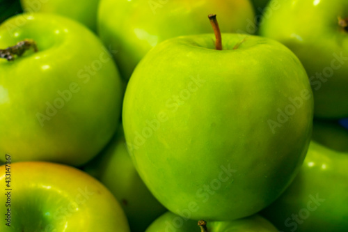 Close up green apples on a market
