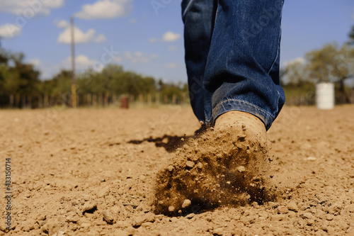 Photography Western boots kicking dirt in outdoor arena during summer shows cowgirl for agriculture concept