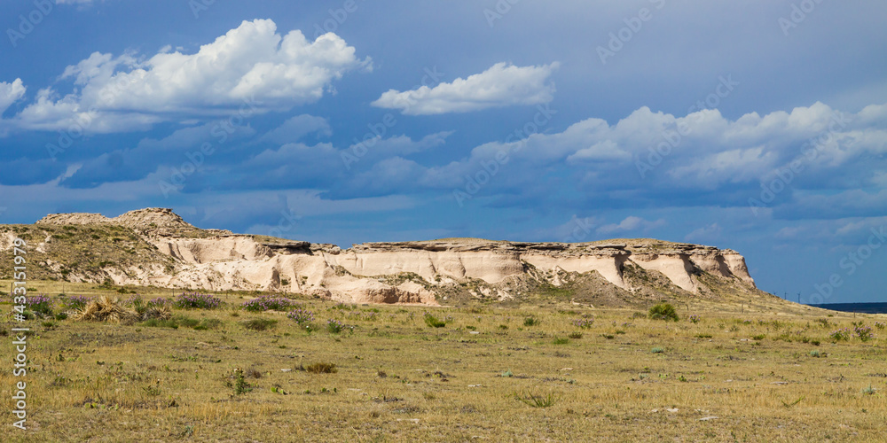 Panoramic photo of the Pawnee Buttes in Pawnee National Grassland, great plains of northeast Colorado with gathering storm clouds