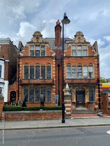 LONDON, UNITED KINGDOM - 09.05.2021. Old Brompton road view in Royal Borough of South Kensington and Chelsea. Facade of the Royal British Society of Sculptors. photo