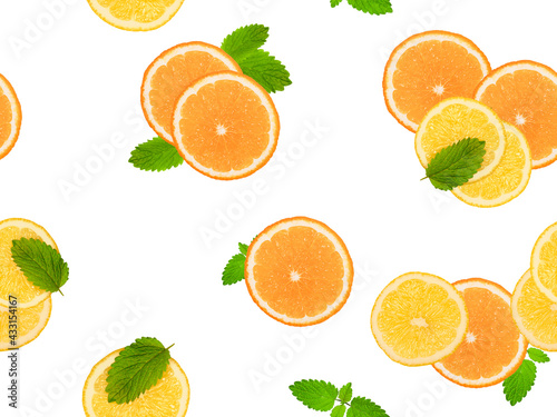 Seamless pattern with orange slices, lemon slices and mint. Top view, food concept, fruit background.