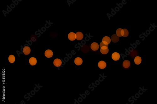 orange bokeh balls and complete black background