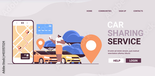 african american woman ordering automobile with location mark in mobile app car sharing service transportation
