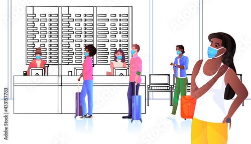 mix race passengers in protective masks standing at check-in counter coronavirus pandemic social distancing concept