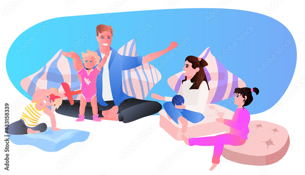 young father playing with little children at home fatherhood parenting concept dad spending time with his kids young father playing with little children at home fatherhood parenting concept dad spending time with his kids
