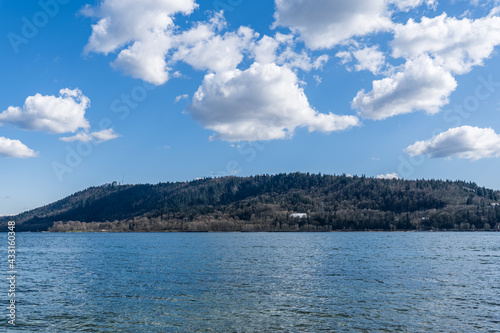 View to Indian Arm from North Vancouver Canada sunny spring day white clouds on blue sky
