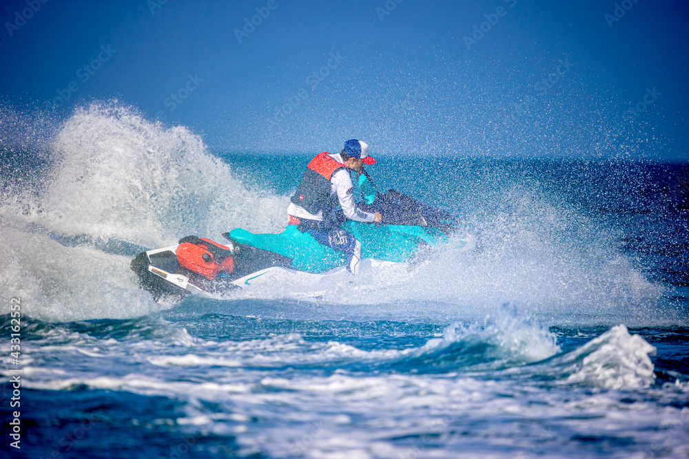 A man driving a jet ski