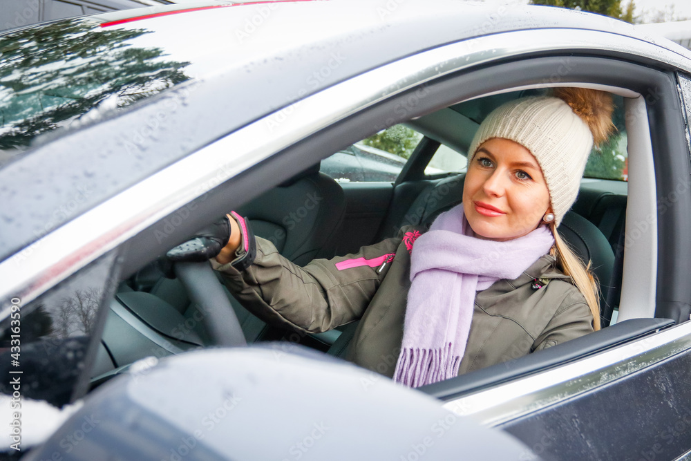 Beautiful woman driving the electric car. Beautiful woman driving the electric car.