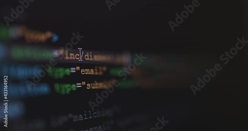 4K Close up shot HTML tag code on PC Monitor scroll down. Background concept for programming and coding web development. photo