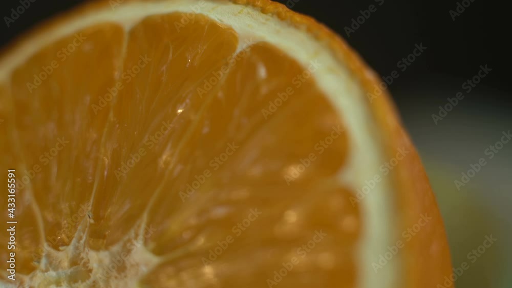 Macro orange fruit slice rotating Macro orange fruit slice rotating