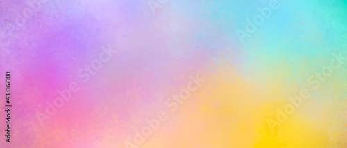 Colorful watercolor background puffy clouds in bright rainbow colors of orange yellow blue and purple