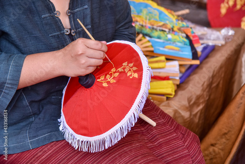 Painting on Handmade umbrella of the village Bo Sang, Chiang mai, Thailand.