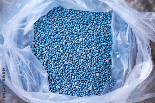 Fertilizer chemical for plants or tree in plastic bag top view photo