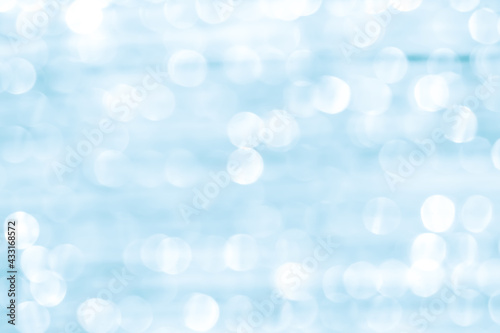 Blurred white light blue glitter abstract bokeh background