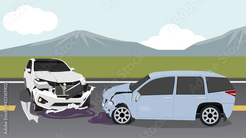 Two cars collide on a asphalt road. The front was badly damaged. Cars rotating across the road. Landscapes of meadows and mountains outside the city