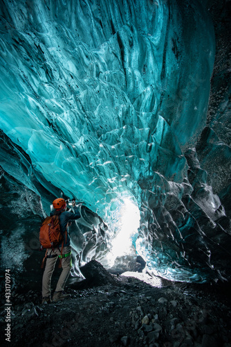 girl in glacier ice cave