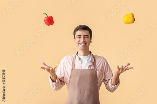 Young man with fresh pepper...