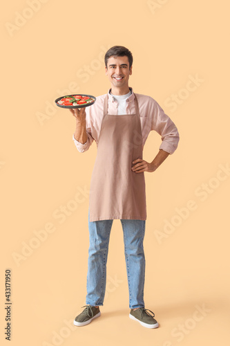 Young man with tasty pizza ...