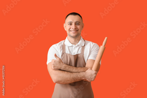 Young man with rolling pin ...