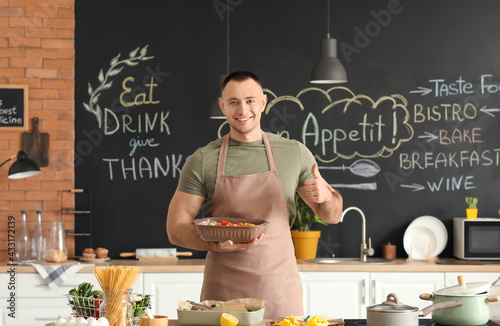 Young man with tasty dish s...