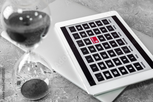 Hourglass with tablet compu...