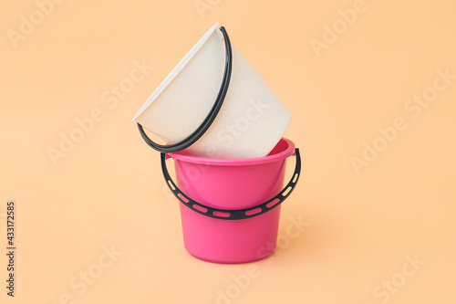 Stacked pink and white plas...