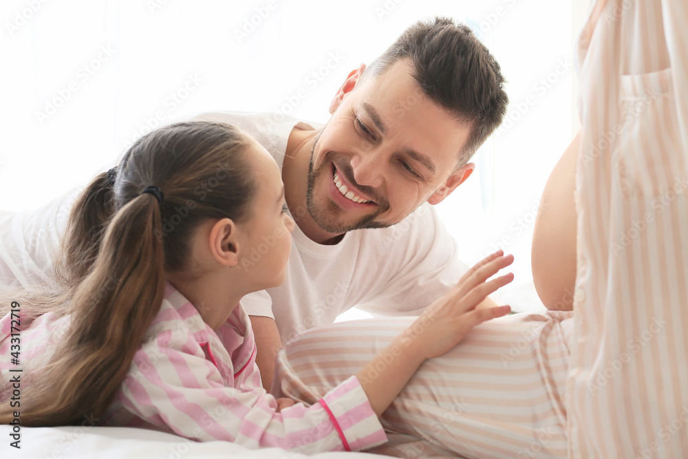 Young pregnant woman with her family at home Young pregnant woman with her family at home