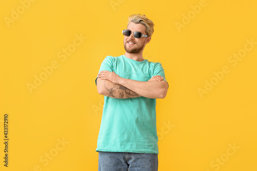 Young man with stylish sung...