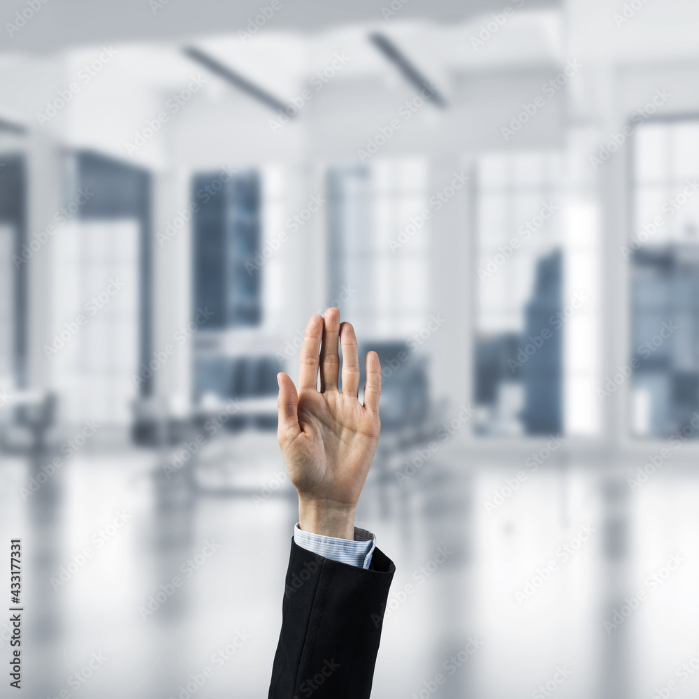 Choosing gesture of businessperson in elegant modern interior in sunshine light Choosing gesture of businessperson in elegant modern interior in sunshine light