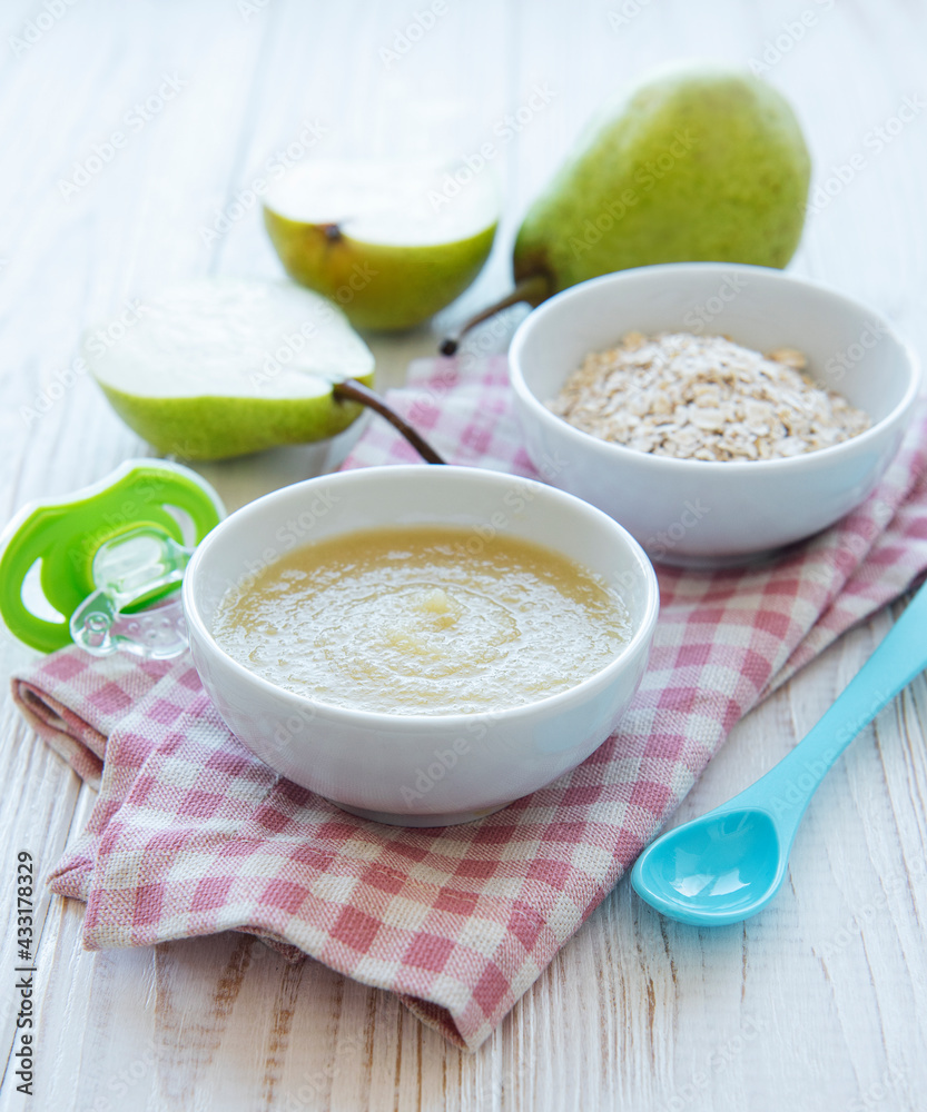 Bowl with fruit baby food and pears Bowl with fruit baby food and pears