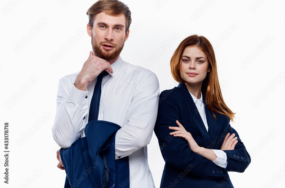 young couple wearing suits stands next to work colleagues communicating finance young couple wearing suits stands next to work colleagues communicating finance