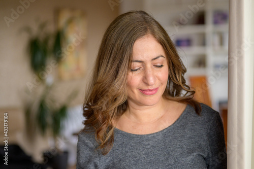 Attractive middle-aged woman with long brown hair