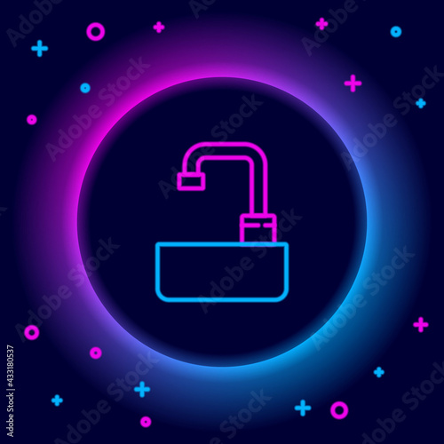 Glowing neon line Washbasin with water tap icon isolated on black background. Colorful outline concept. Vector