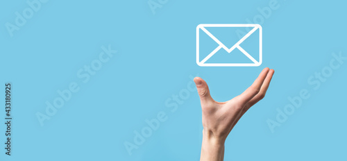 Male hand holding letter icon,email icons .Contact us by newsletter email and protect your personal information from spam mail. Customer service call center contact us.Email marketing and newsletter