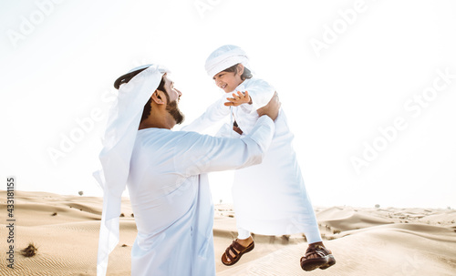 father and son spending time in the desert