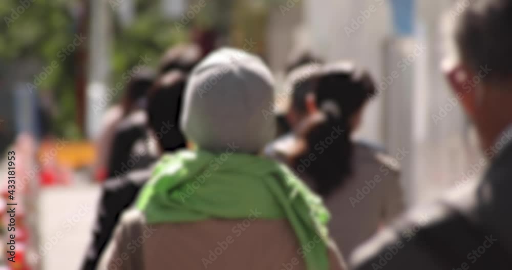 A slow motion of walking people at urban city in Tokyo defocused