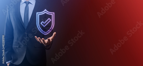 Fototapeta Naklejka Na Ścianę i Meble -  Protection network security computer in the hands of a businessman. business, technology, cyber security and internet concept - businessman pressing shield button on virtual screens Data protection