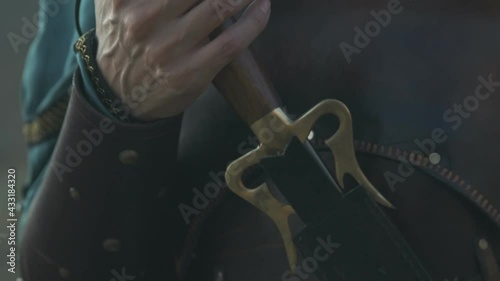 Beautiful woman holds a sword. warrior soldier slow motion