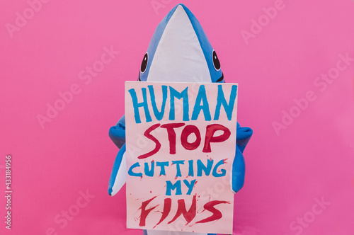 Character shark has a message for humanity about stop shark fishing and finning photo