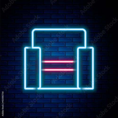 Glowing neon line Cinema chair icon isolated on brick wall background. Colorful outline concept. Vector