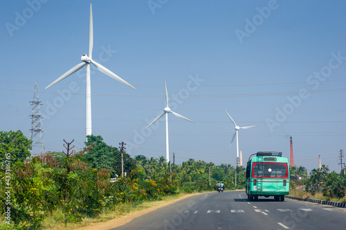 Generic Rural Bus on the road and wind turbines