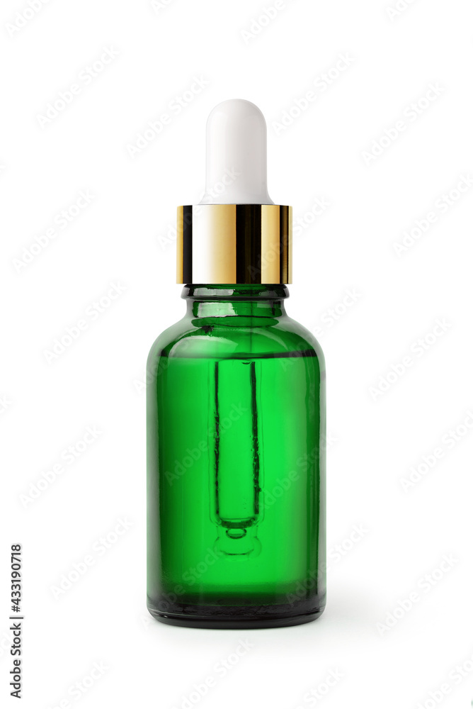 Essential serum oil in green dropper bottle with gold cap isolate on white background. Clipping path.