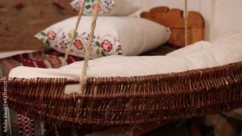 Vintage empty wooden cradle from the 19th century. A sense of antiquity