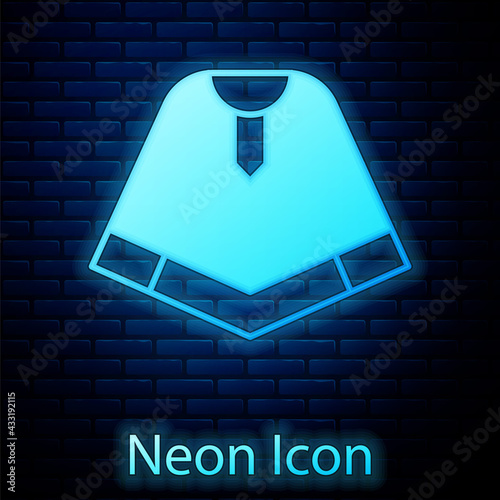 Glowing neon Traditional mexican poncho clothing icon isolated on brick wall background. Vector