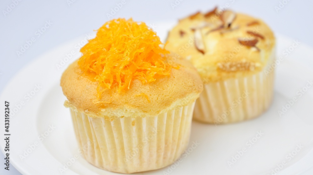 Delicious golden foi cupcakes on white background Delicious golden foi cupcakes on white background