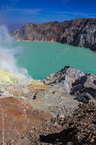 Aerial view of Kawah Ijen acid lake and sulfur mines from the top of volcano. The Ijen volcano complex is a group of composite volcanoes in the Banyuwangi Regency of East Java island, Indonesia.