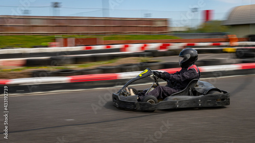 A panning shot of a racing kart as it circuits a track. © SnapstitchPhoto