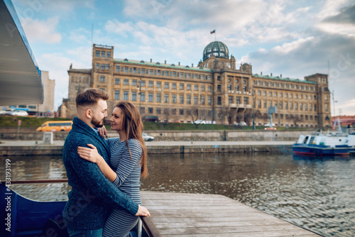 Loving young couple walking around Prague, Czech Republic