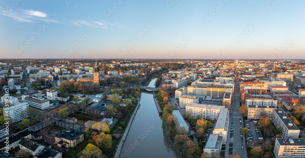 Aerial panorama of Turku city center, Cathedral of Turku and Aura river in spring in Finland.